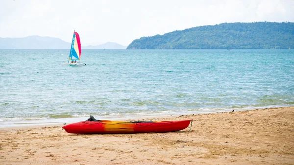Sailing-boat and kayak — Stock Photo, Image