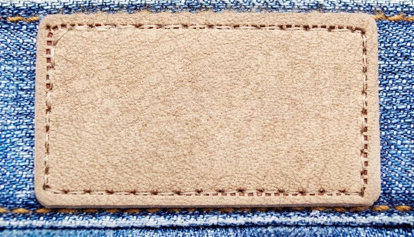 Gele etiket op jeans — Stockfoto