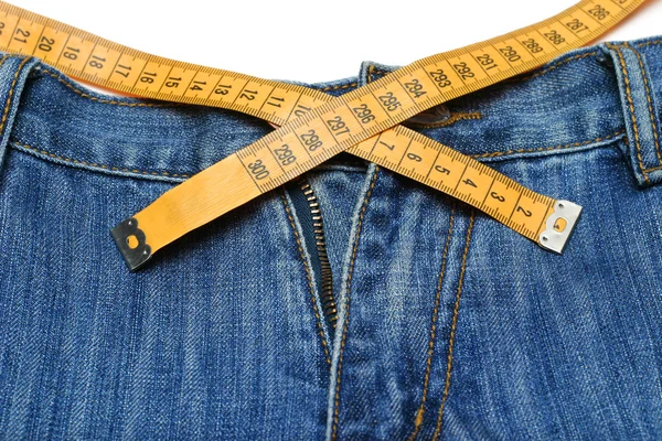 Kot pantolon ve şerit metre — Stok fotoğraf