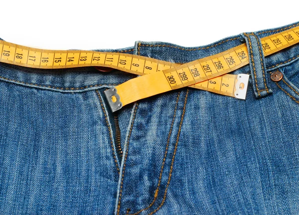 Измерительная лента вокруг брюк — стоковое фото