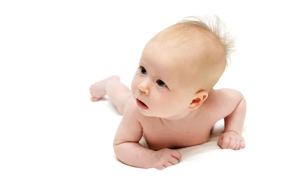 Rastejando bebê olhando para a esquerda — Fotografia de Stock