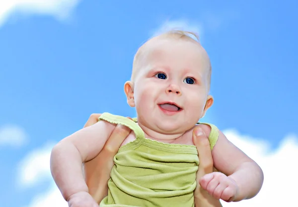 Newborn on blue sky — Stock Photo, Image
