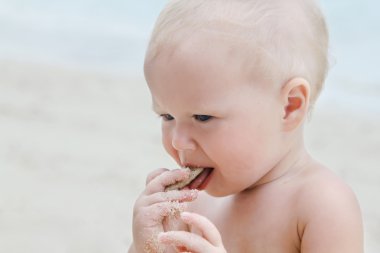 Baby on the beach clipart