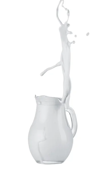 Cream splashing out of jug — Stock Photo, Image