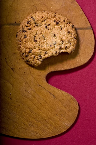 Μπισκότο σοκολάτας, πάνω σε ένα ξύλο κοπής Royalty Free Φωτογραφίες Αρχείου