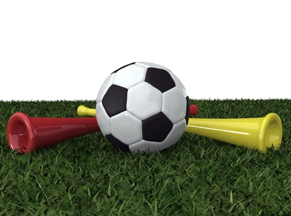 Футбольний м'яч на траві з двома вувузелами — стокове фото