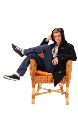 Man sitting on an armchair clipart