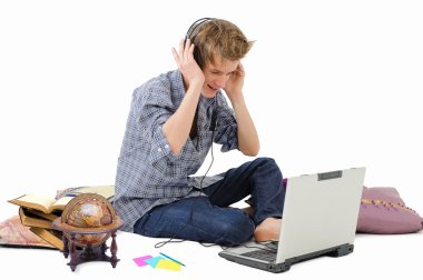 Man with headphones and laptop clipart