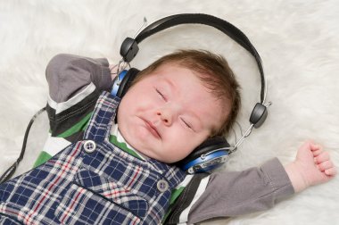 Kid listening to music clipart