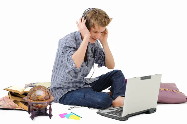 Man with headphones and laptop Stock Picture