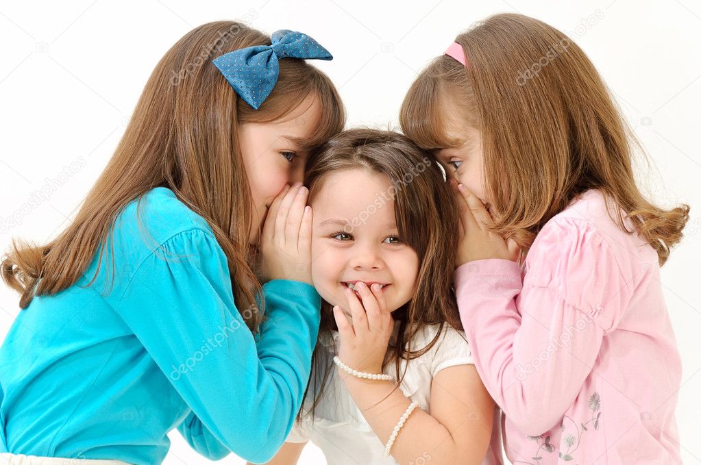 Girls telling a secret