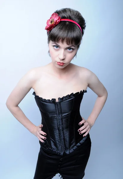 Serios woman it the corset — Stock Photo, Image
