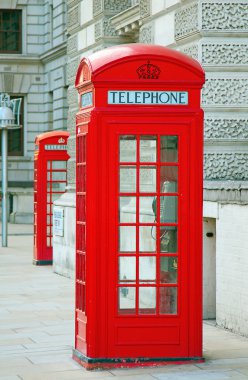 Red telephone booth in London clipart