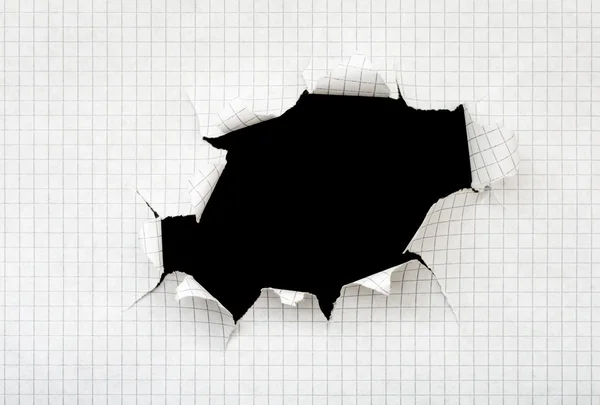 Loch in einem Blatt Papier — Stockfoto