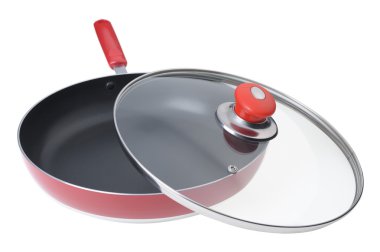 Frying pan with the slightly opened glass cover clipart