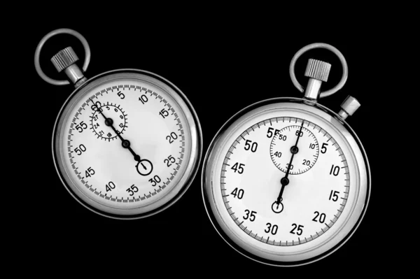 Due cronometro su nero — Foto Stock
