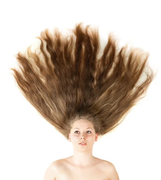 Zbliżenie zdrowy piękne długie włosy w ruch stworzony przez wiatr — Zdjęcie stockowe