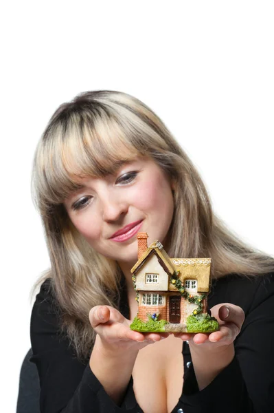 The business woman holds the small house in the hands — Stock Photo, Image