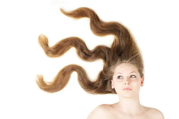 風によって作成されたモーションの健康な美しい長い髪のクローズ アップ ストック画像