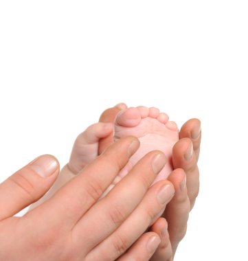 Foot the baby in adult hands clipart