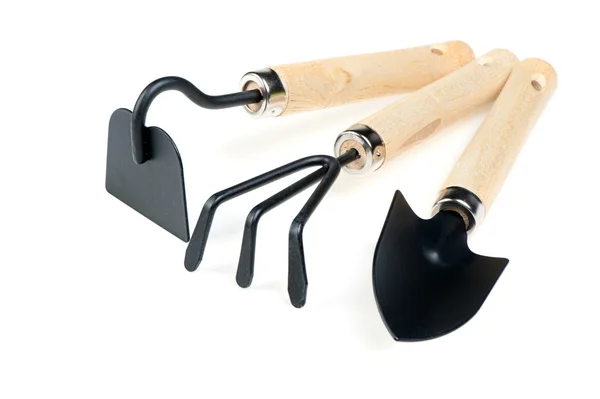 花园工具铁锹、 耙子、 一把菜刀 — 图库照片