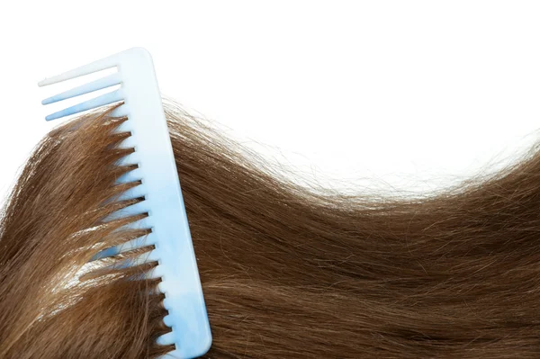 Hairbrush and long hair — Stock Photo, Image