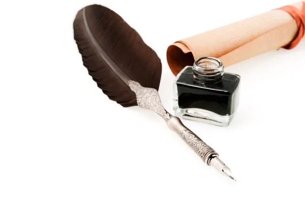 Feather quill ,inkwell and parchment roll — Stock Photo, Image