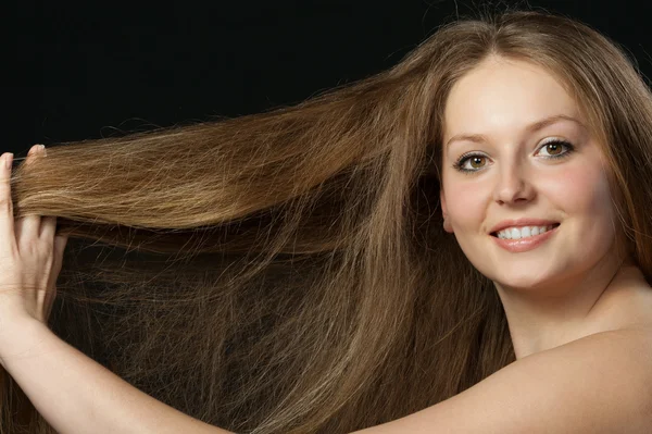 A portrait close up of the beautiful girl with long hair — Stock Photo, Image