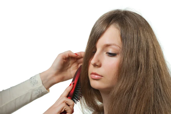 Дівчині з довгим волоссям укладають перукарню — стокове фото