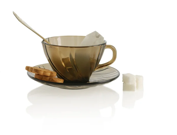 stock image Cup with cookie, spoon, sugar anf package tea