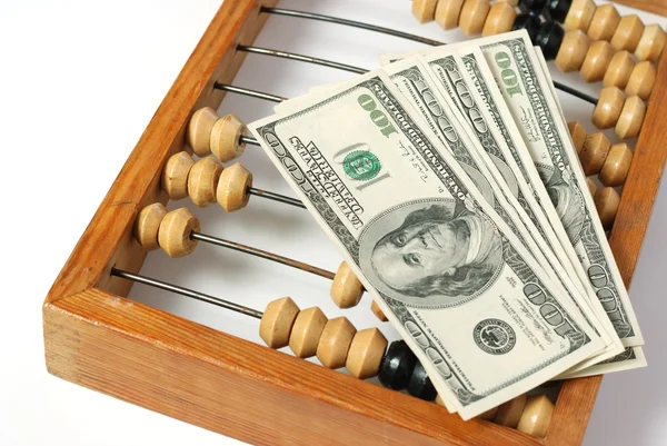 Abacus e dólares — Fotografia de Stock