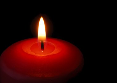 Candle. A burning flame of a candle of red color clipart