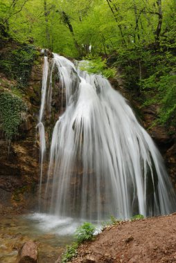 Picturesque stream of falling water clipart