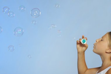 The pretty girl with soap bubbles clipart