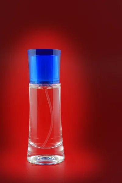 Bottle perfume in light — Stock Photo, Image