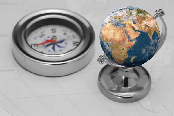 Kompas en aarde — Stockfoto