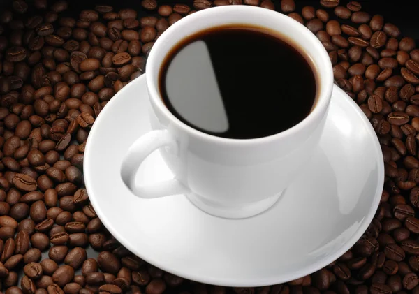 Taza de café con punto culminante —  Fotos de Stock