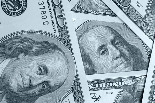Dólar close up fundo azul cor — Fotografia de Stock