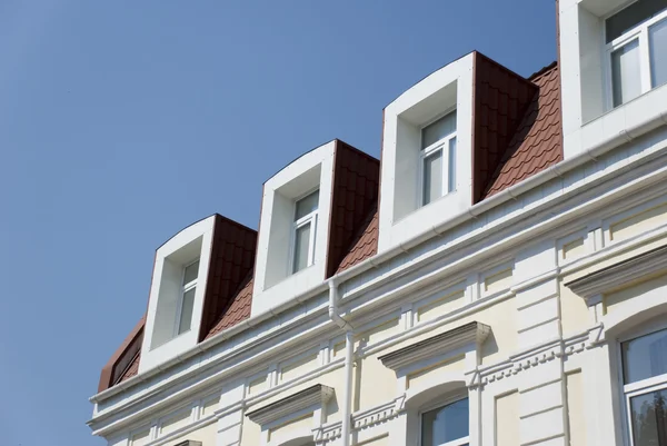 stock image Facade of a building with attics.