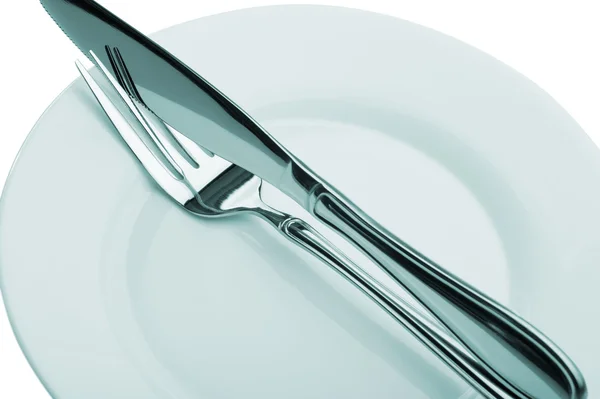 Nůž a vidlička na talíři — Stock fotografie