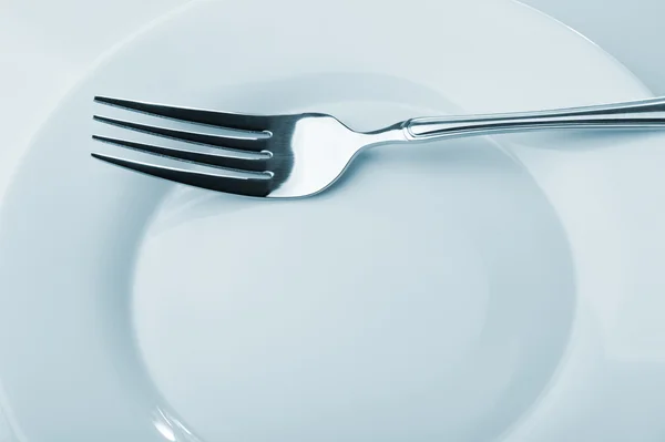 Tenedor en un plato — Foto de Stock