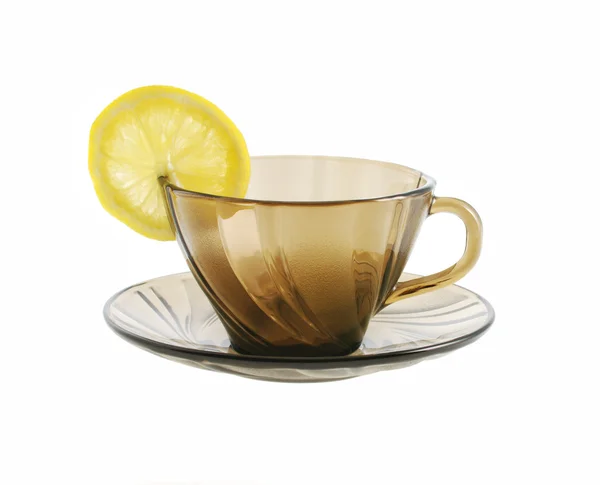 Glass transparent cup and lemon — Stock Photo, Image