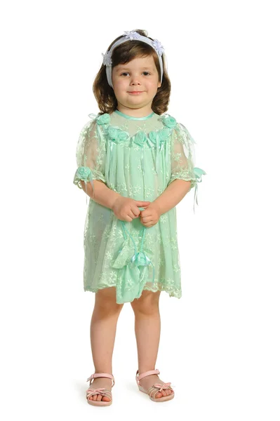 Den vackra lilla flickan i en grön klänning — Stockfoto