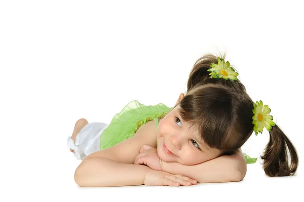Pretty the little girl lies on the white — Stock Photo, Image