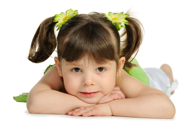 Pretty the little girl lies on the white — Stock Photo, Image
