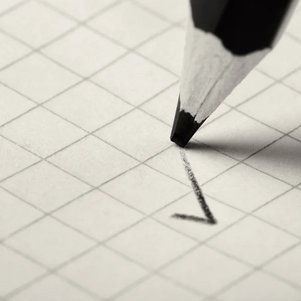 Pencil writing a mark — Stock Photo, Image