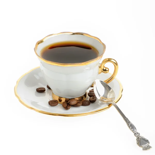 Xícara de café elegante com colher de prata e semente — Fotografia de Stock
