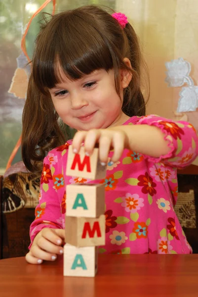 The girl and word mama from cubes — Stock Photo, Image