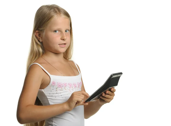 A menina de nove anos a loira com a calculadora — Fotografia de Stock