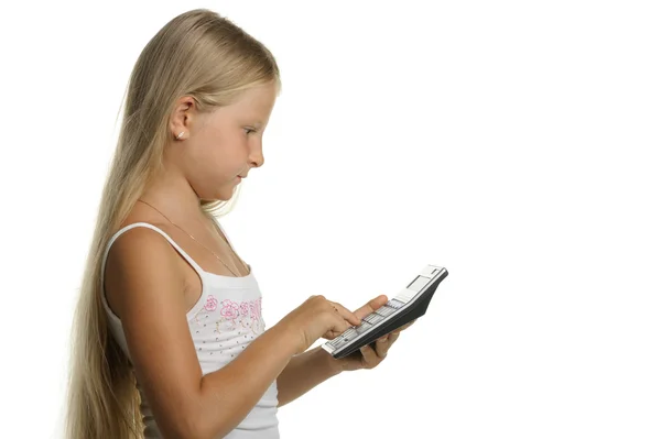 La chica de nueve años la rubia con la calculadora — Foto de Stock